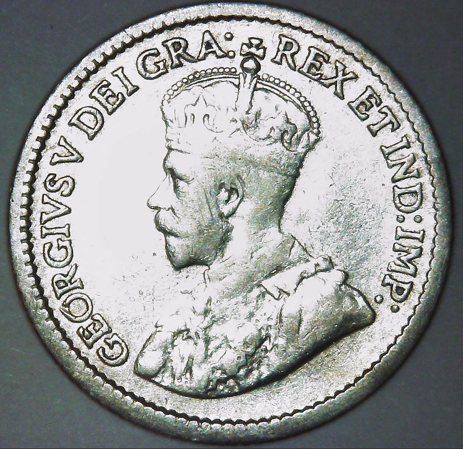 1900-Round-0-And-1915-Five-Cents
