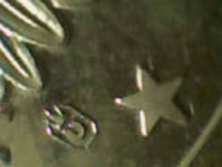 Anyone-Familiar-With-This-Stamp/Logo