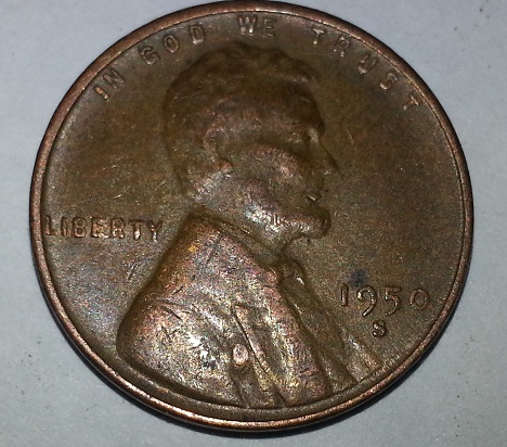 1950-S-Penny-With-Ruptured-Gas-Bubble,-Blow-Hole,-Or-PMD?