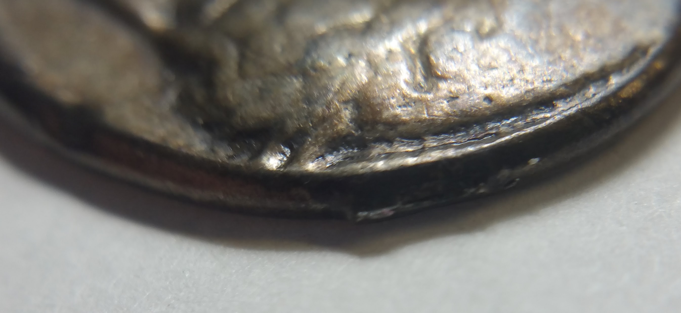 Coin:-One-Side-Mans-Head-/-Other-Side-Lions-Head