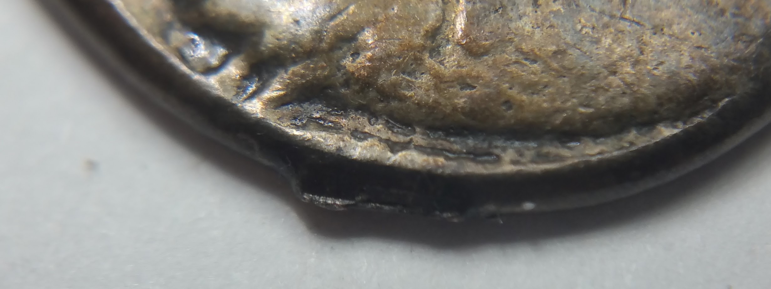 Coin:-One-Side-Mans-Head-/-Other-Side-Lions-Head