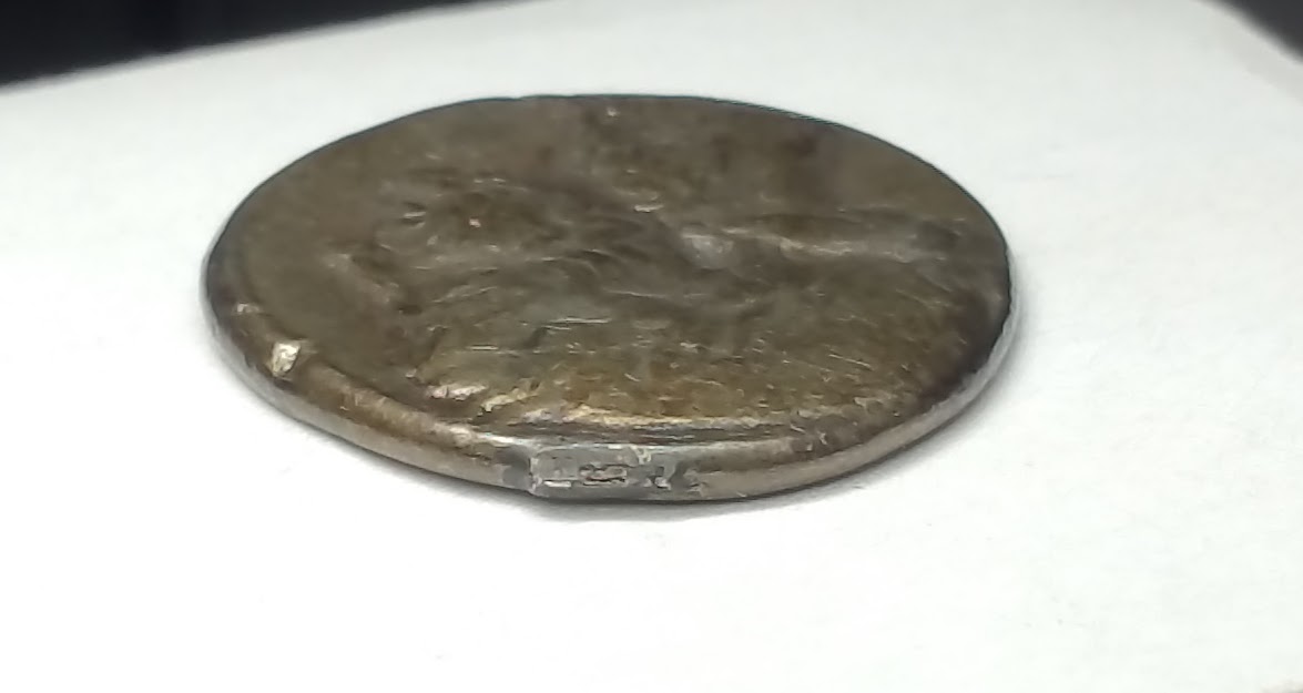 Coin:-One-Side-Mans-Head-/-Other-Side-Lions-Head