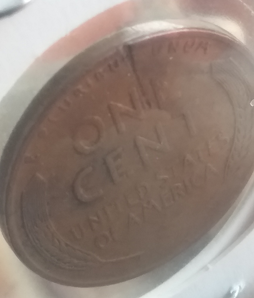 1945-P-Wheat-Penny-Struck-With-Looks-Like-A-Staple-It-Rapped-Around-The-Rim-Of-The-Coin