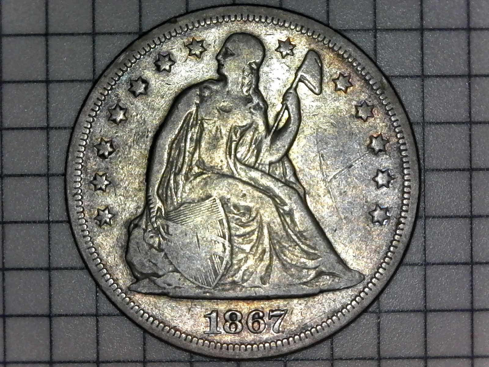 What-Grade?-1867-Liberty-Seated-Dollar
