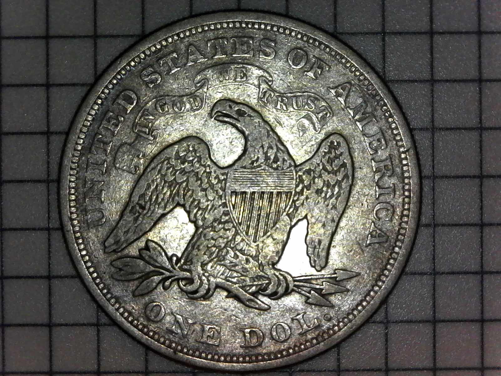 What-Grade?-1867-Liberty-Seated-Dollar