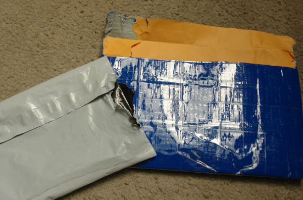 Unknowing-Seller-Taping-Coins-When-Shipping.