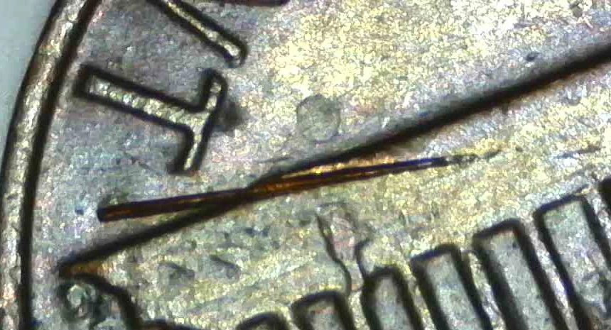 1982-Penny-Marks-On-Rim-And-Others-Damage?