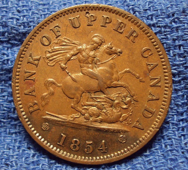 1854-Bank-Of-Upper-Canada-One-Penny-Bank-Token,-Looking-For-A-Grade-Please.