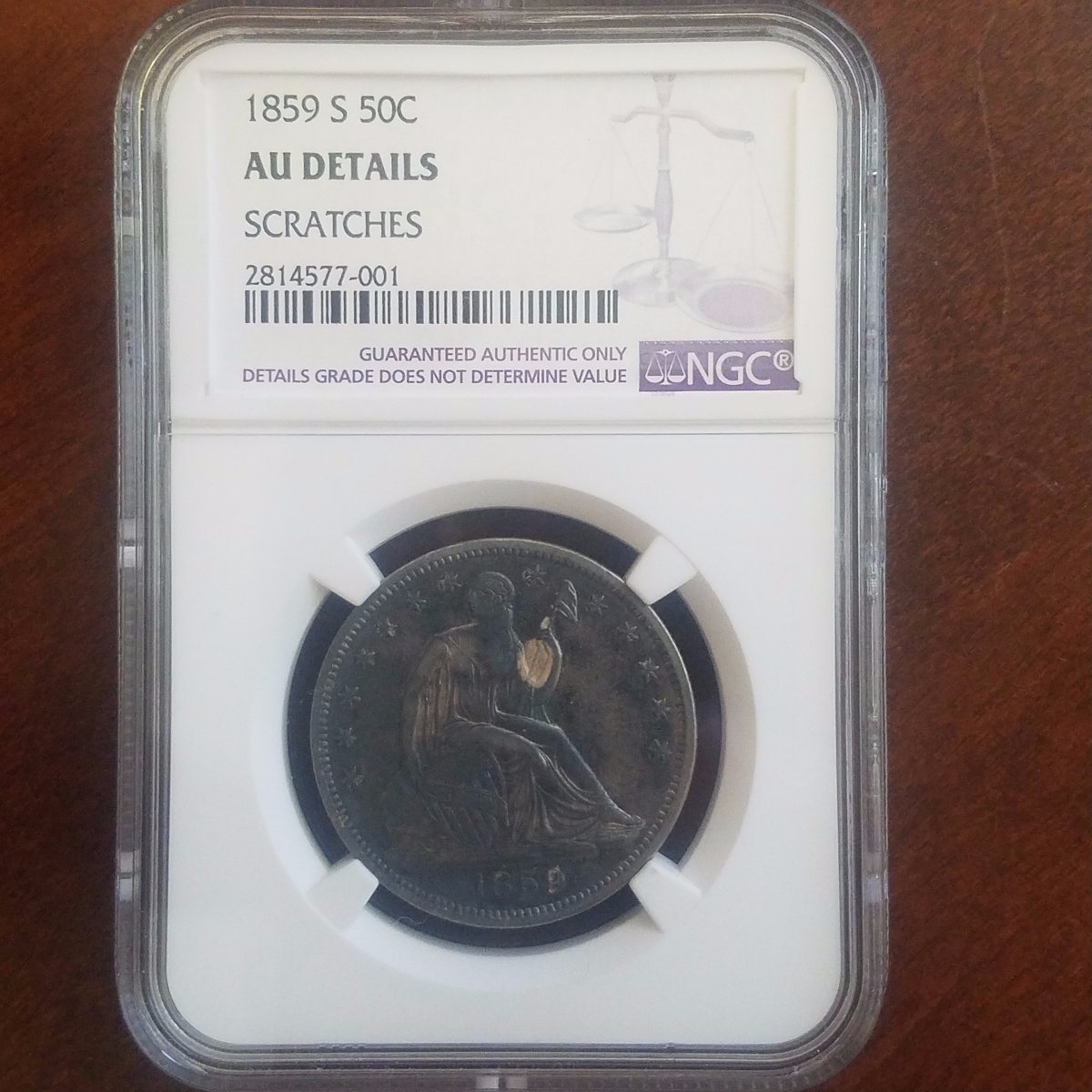 Fire-Damage-Of-1859-S-Seated-Liberty-Half-Dollar