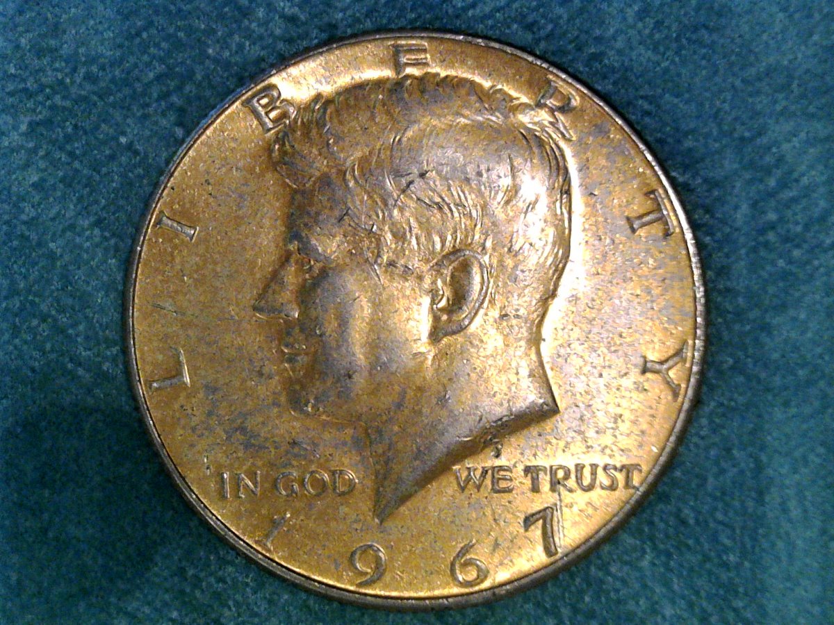 Strange-Gold-Tone-On-Kennedy-Half