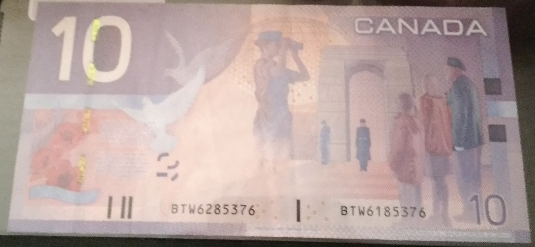 1954-Canadian-One-Dollar-Notes-With-Mismatched-Serial-Numbers