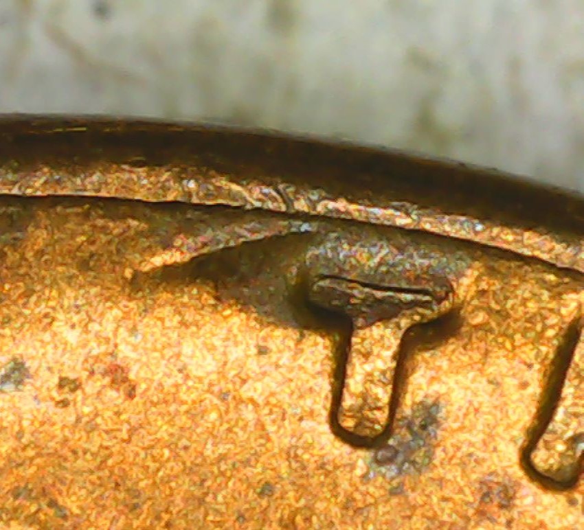 1955-S-One-Cent-Cracked-And-Raised-Areas