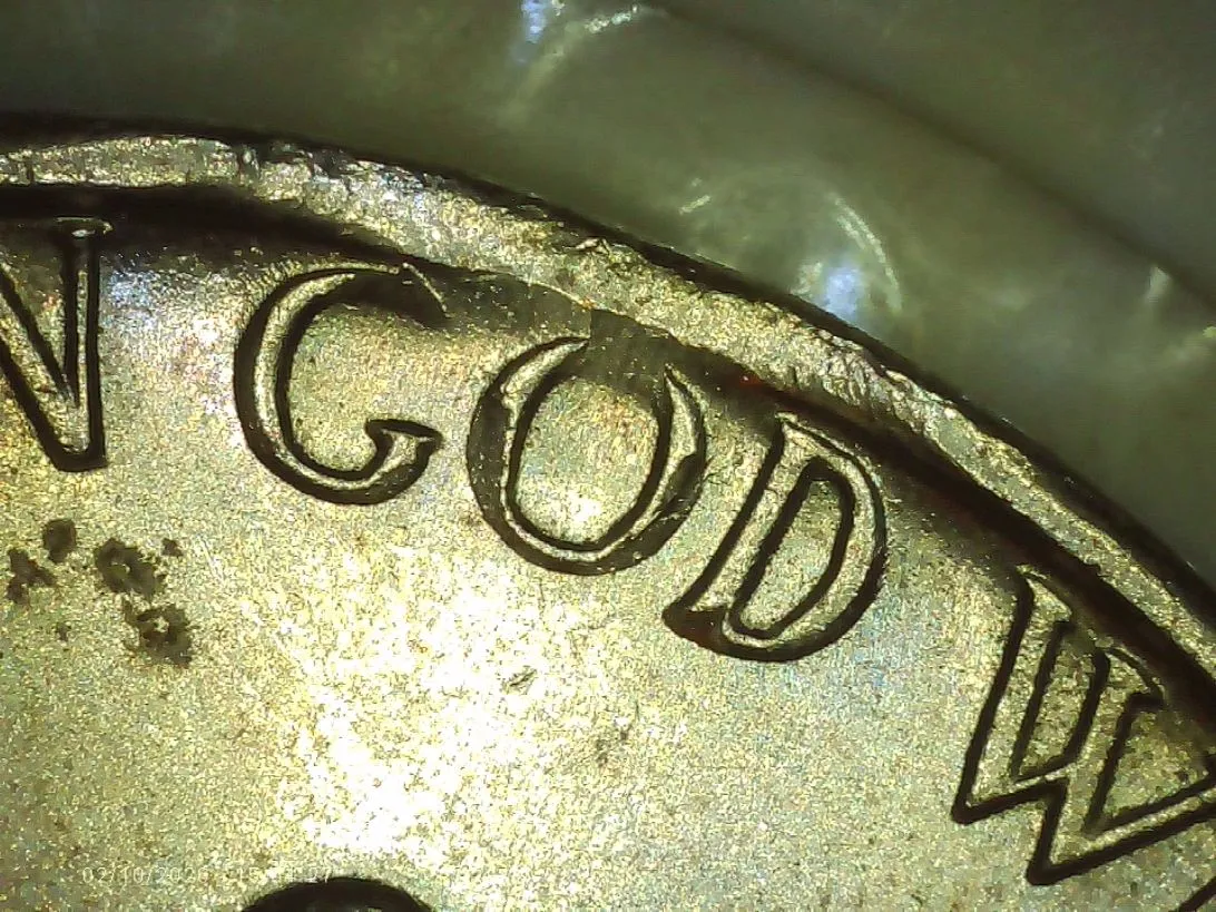 1964-D-Nickel-With-3-Clips?