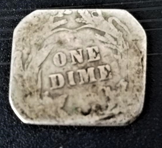 Any-Ideas-On-How-This-Barber-Dime-Got-Reshaped