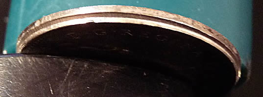 1975-Nickel---Partially-Struck-Out-Of-Collar?