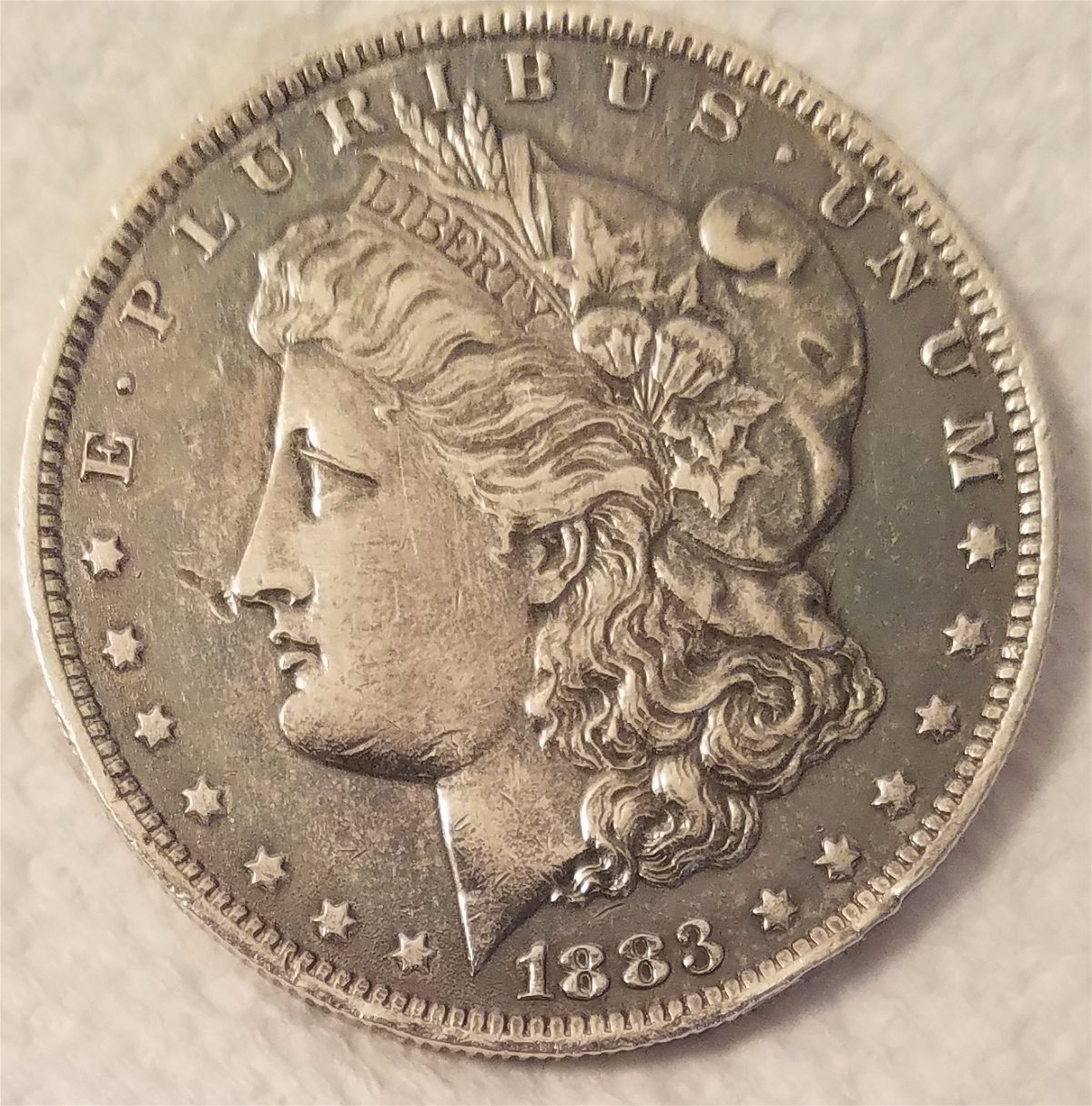 1883-O-Morgan-Dollar,-Interesting-Toning