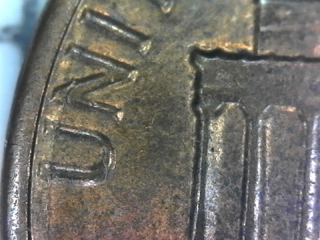 1984-D-Lincoln-Penny-With-Semi-Circular-Crack-In-Reverse.