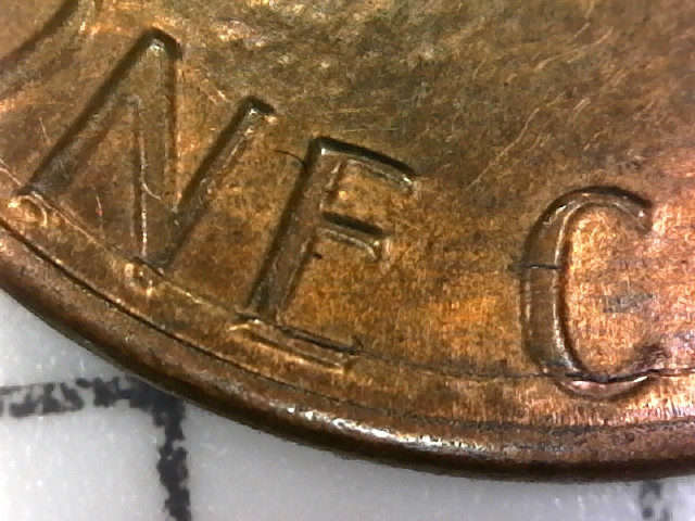 1984-D-Lincoln-Penny-With-Semi-Circular-Crack-In-Reverse.