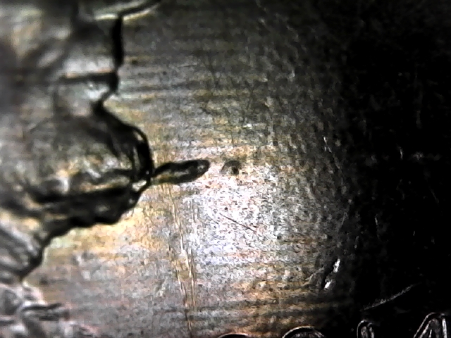 2014-D-Lincoln-Penny-With-Something-Protruding-From-His-Beard.