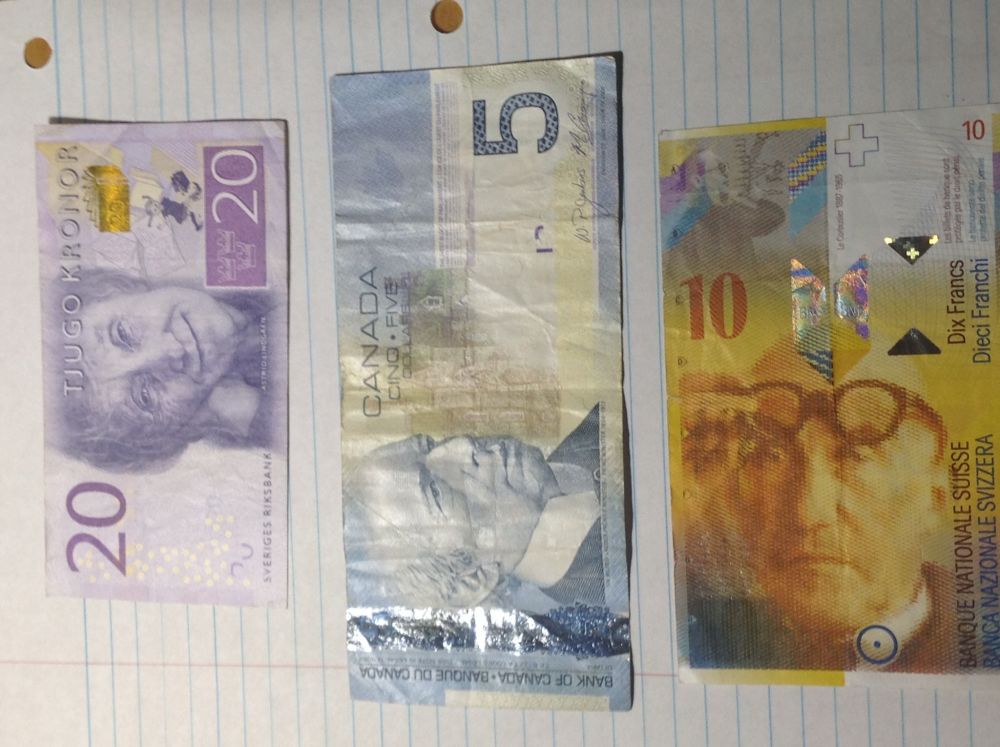 Marking-The-200th-Post-With-World/Us-Banknotes