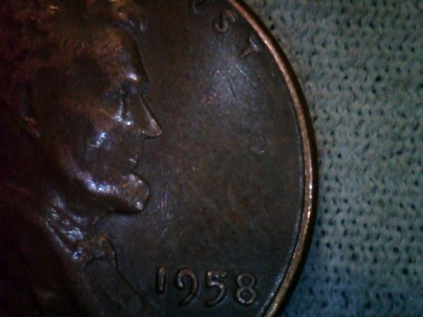 1958-Penny-Two-Eyes-Are-Seen-In-Profile,-Please-Confirm