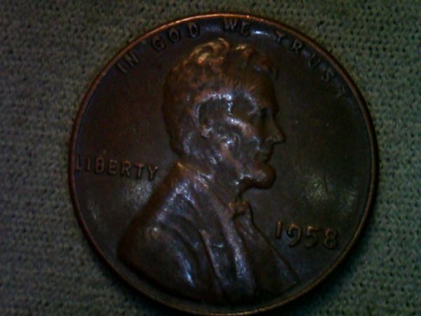 1958-Penny-Two-Eyes-Are-Seen-In-Profile,-Please-Confirm