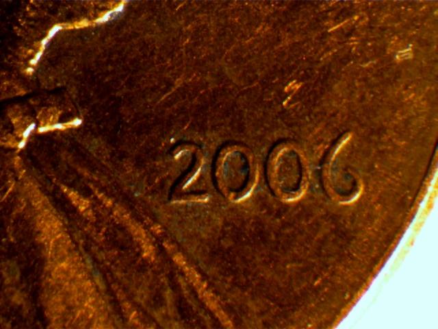 2006-Penny,-Part-Of--Design,-Damage-Or-Ear-Lobe-?