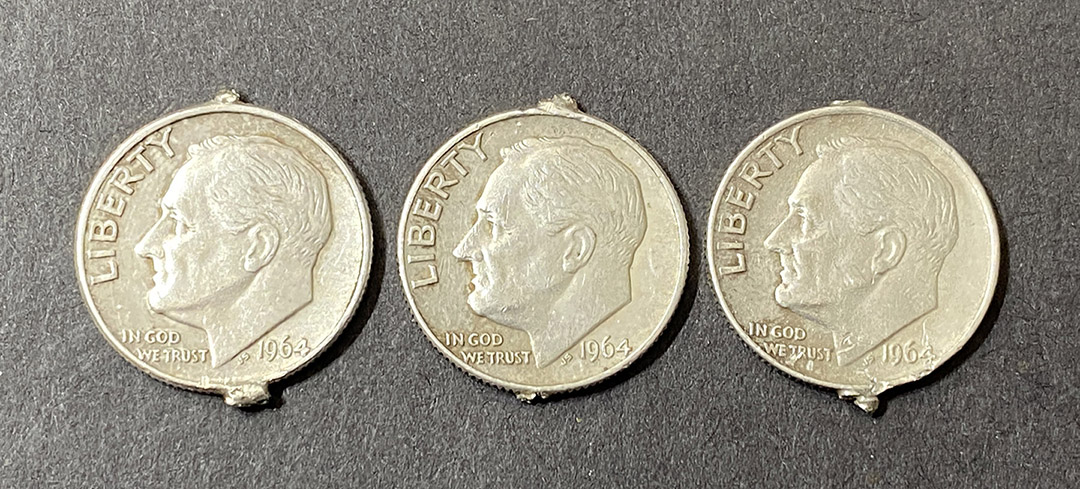 1964-Roosevelt-Dime-With-Tabs-On-Top-And-Bottom
