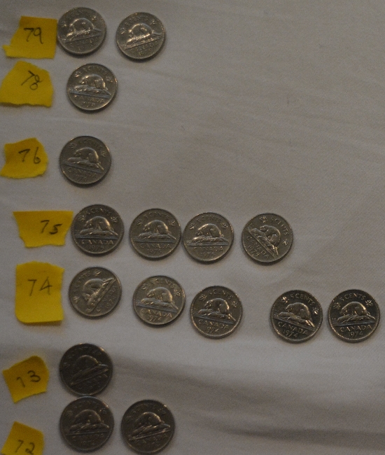 Piles-Of-Old-Nickels-And-Pennies