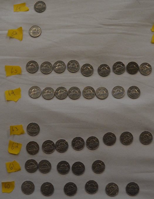 Piles-Of-Old-Nickels-And-Pennies