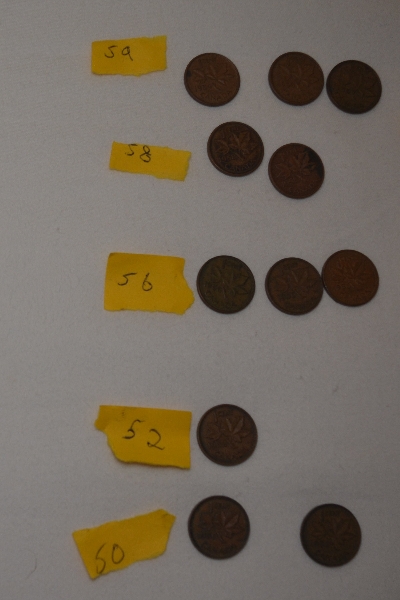 Piles-Of-Old-Nickels-And-Pennies