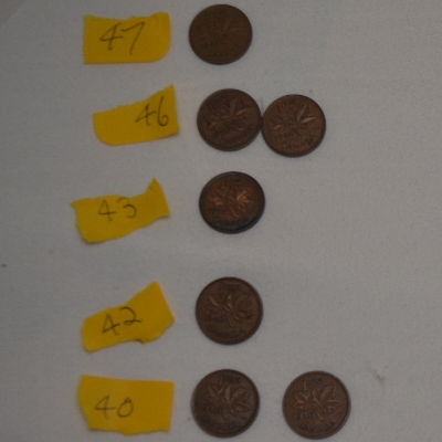 Piles-Of-Old-Nickels-And-Pennies