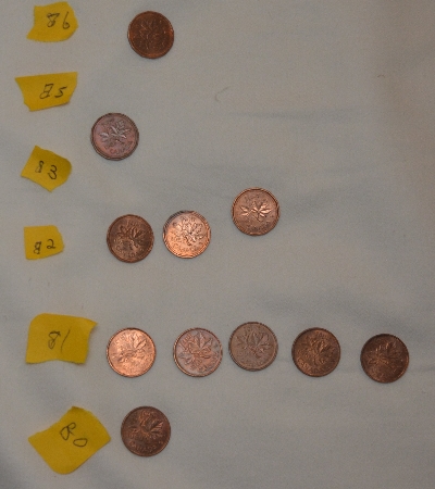 Piles-Of-Old-Nickels-And-Pennies