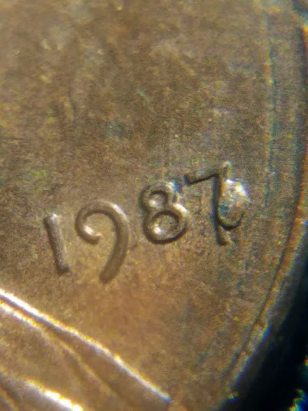 1987-Penny-With-Melted-Dot-Next-To-7.