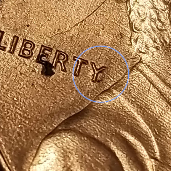 1983-Penny-With-Some-Die-Cracks-And-Something-