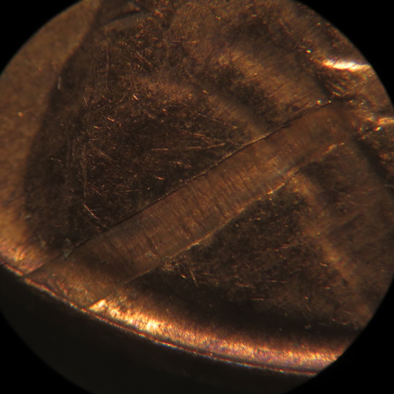 1963-D-LMC-Struck-Through-Debris-Or-Lamination