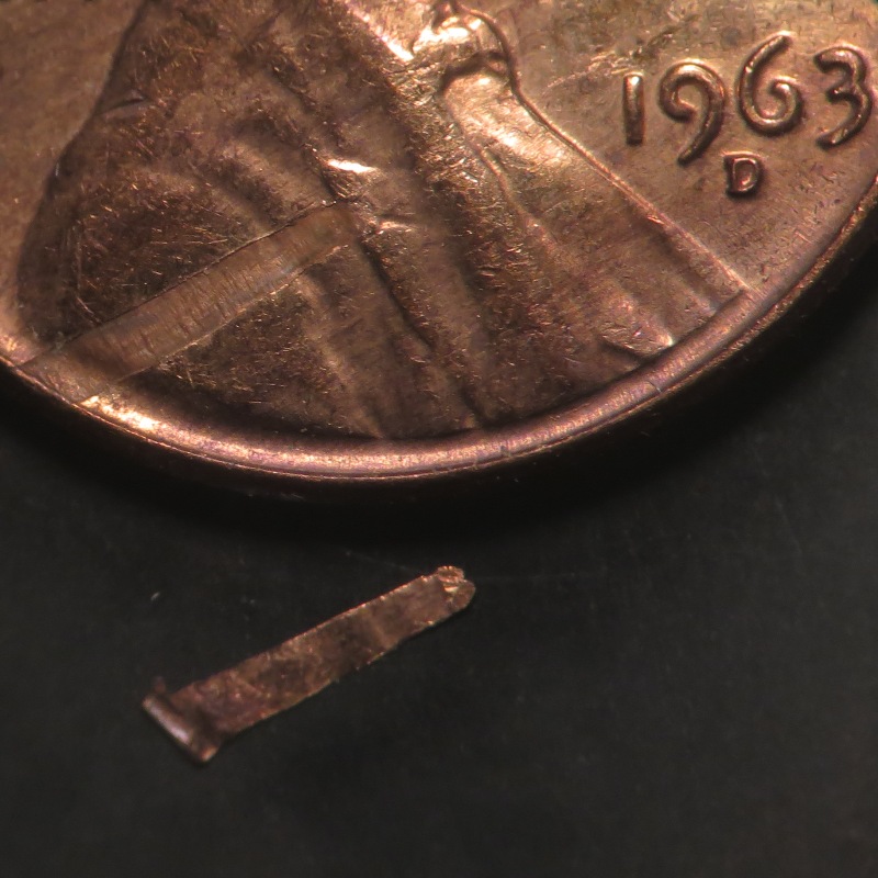 1963-D-LMC-Struck-Through-Debris-Or-Lamination
