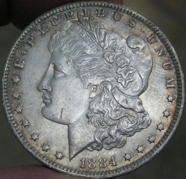 1884-O-Morgan-With-Strike-Through,-Die-Break-&-Clash?