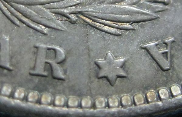 1884-O-Morgan-With-Strike-Through,-Die-Break-&-Clash?
