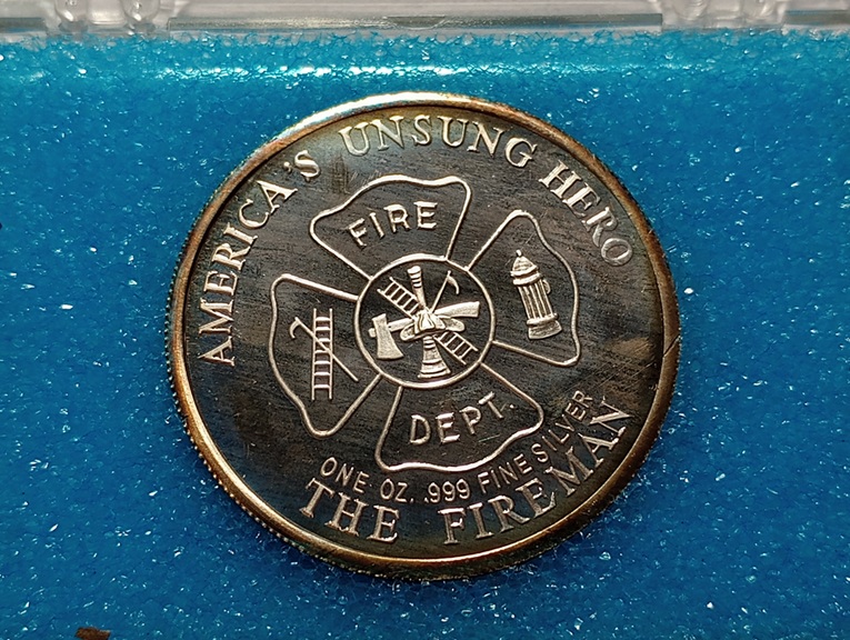 1986-America's-Unsung-Hero-The-Fireman-1-Oz-.999-Silver-Round