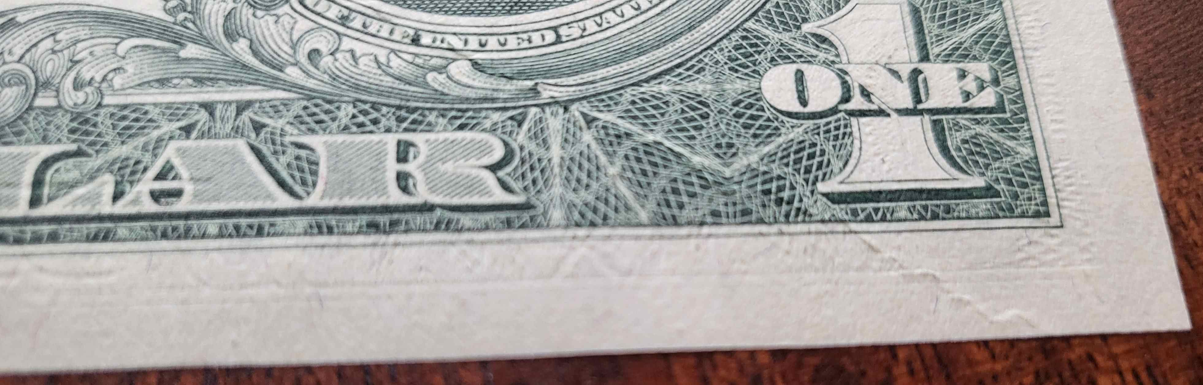 1969-D-$1-Error-With-String-In-Paper