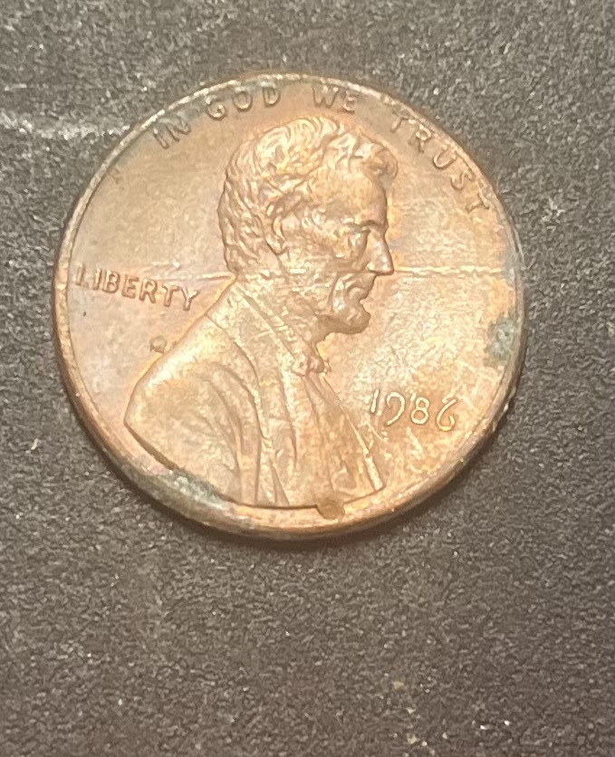 1986-No-Mint-Mark-Penny-With-Line-Through-Lincoln's-Face