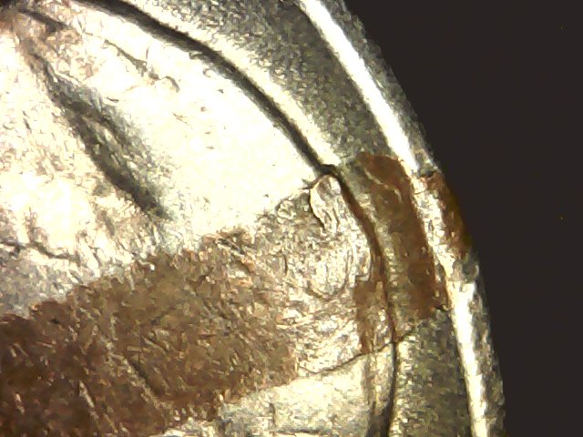 1959-D-Nickel-With-Something-Struck-Onto....