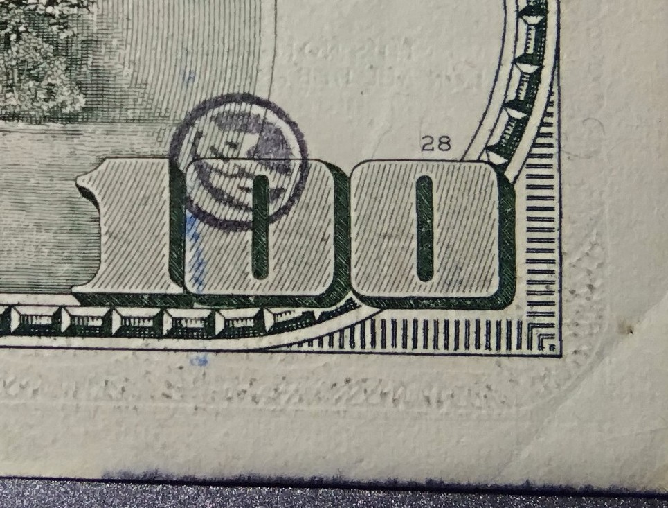 Ink-Stamps-On-$100-Bills