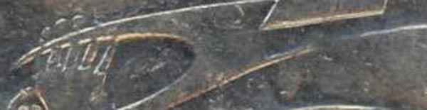 4-Half-Claws-On-20-Cent-Coin