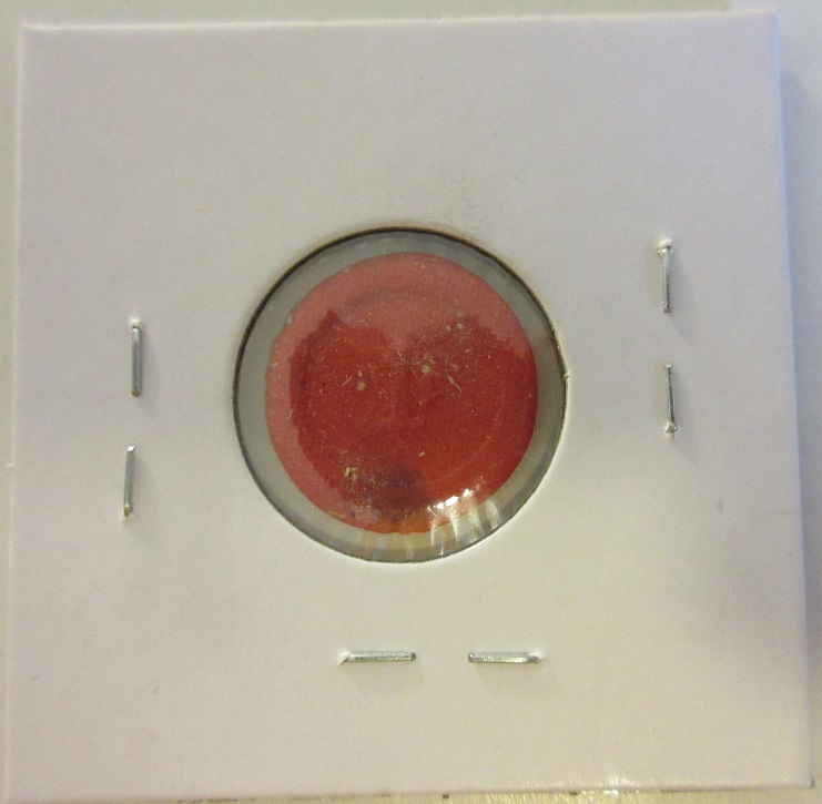 Broad-Strike-And-Struck-Through-Cloth-Plastic-Token?