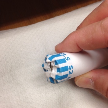 Wrapped-Coins-In-Boxes,-How-Do-You-Open-The-Rolls?