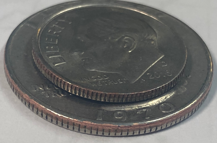 Copper-Showing-In-The-Rims-Of-Clad-Coins