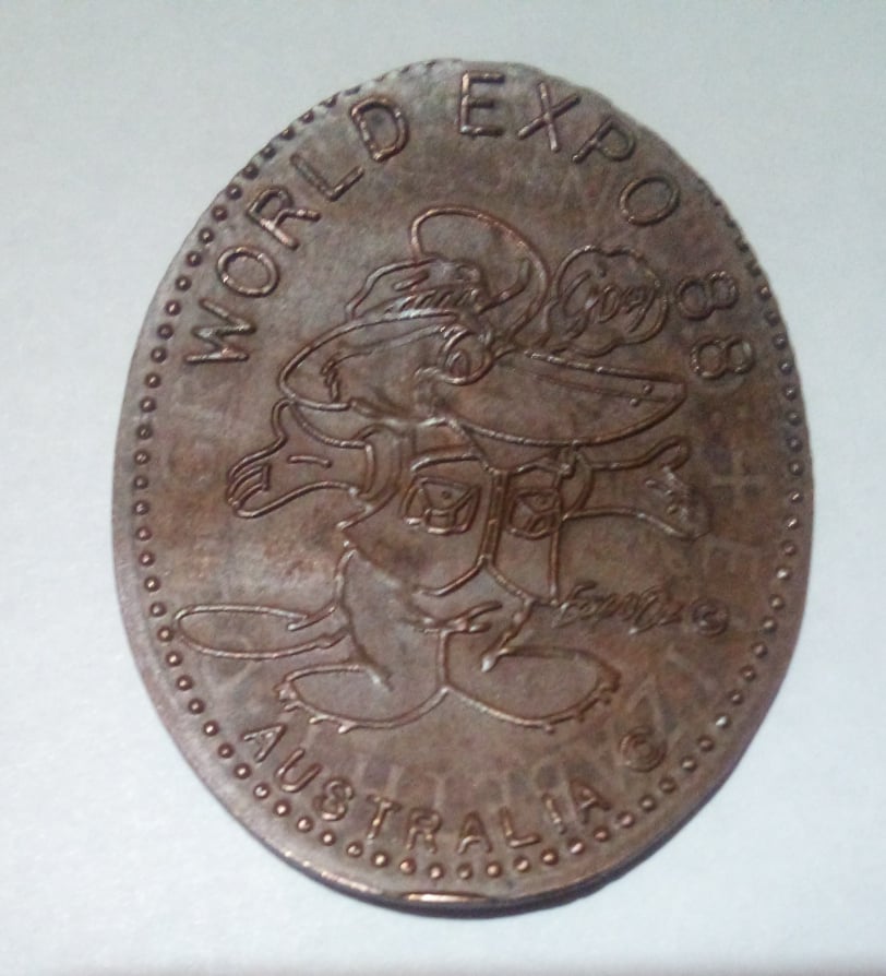 1988-World-Expo-Token-Elongated-On-1958-Y.-Qeii-Penny-Copper