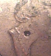 Hole-In-Queen's-Neck-On-A-Twoonie....